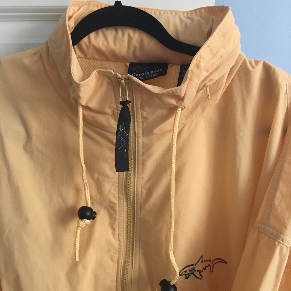 Greg Norman yellow rain coat.